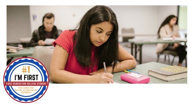 girl with long dark hair and red shirt sitting at desk working on homework